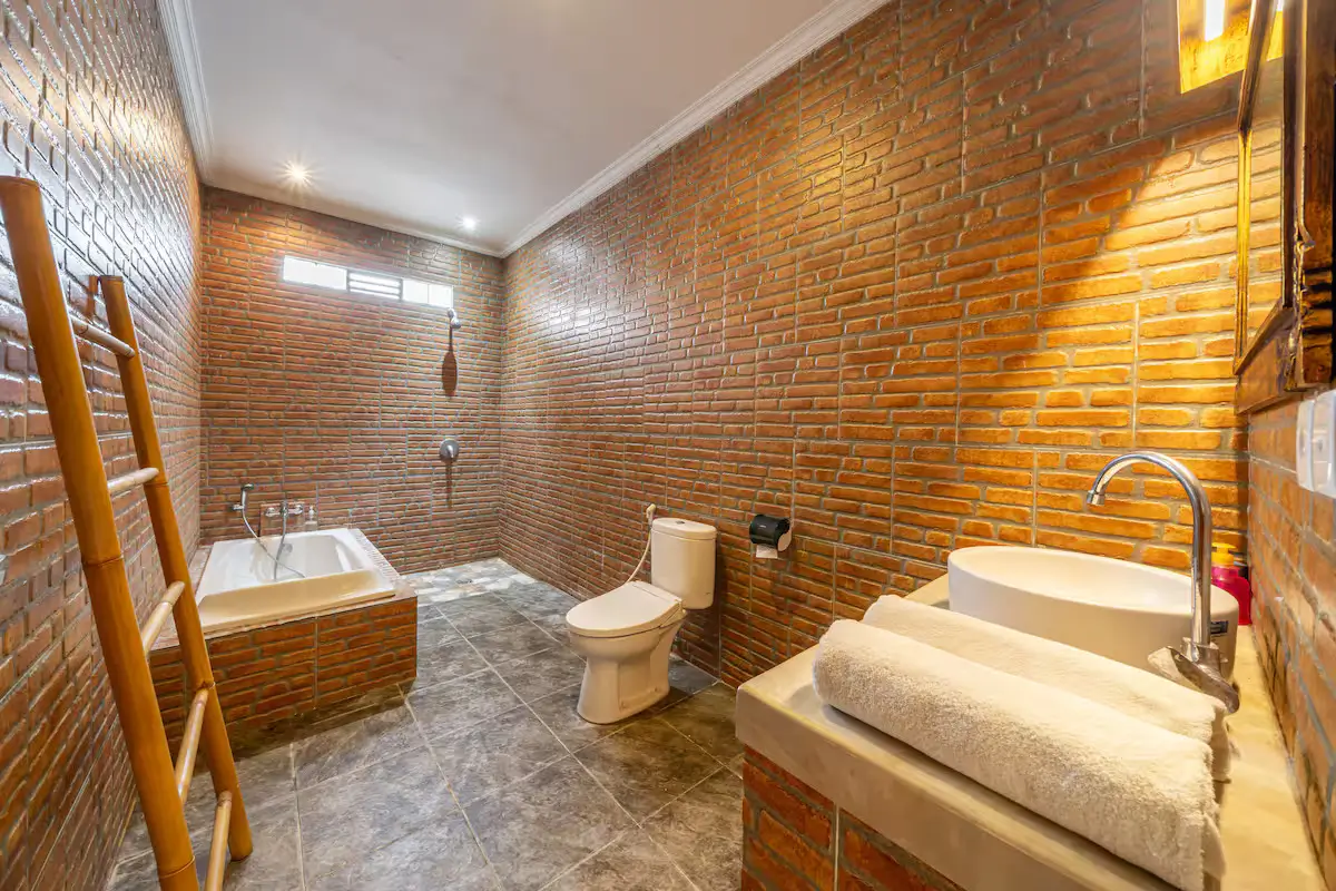 Rejuvenating bathroom in your Kuta Utara Bali villa Elegant bathroom with rain shower and modern finishes in Bali villa