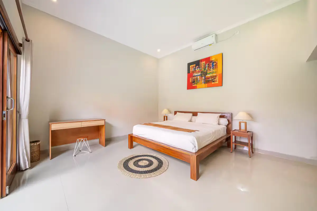Comfortable private bedroom at your luxury Bali villa Cozy air-conditioned bedroom with plush bedding at Kuta Utara villa