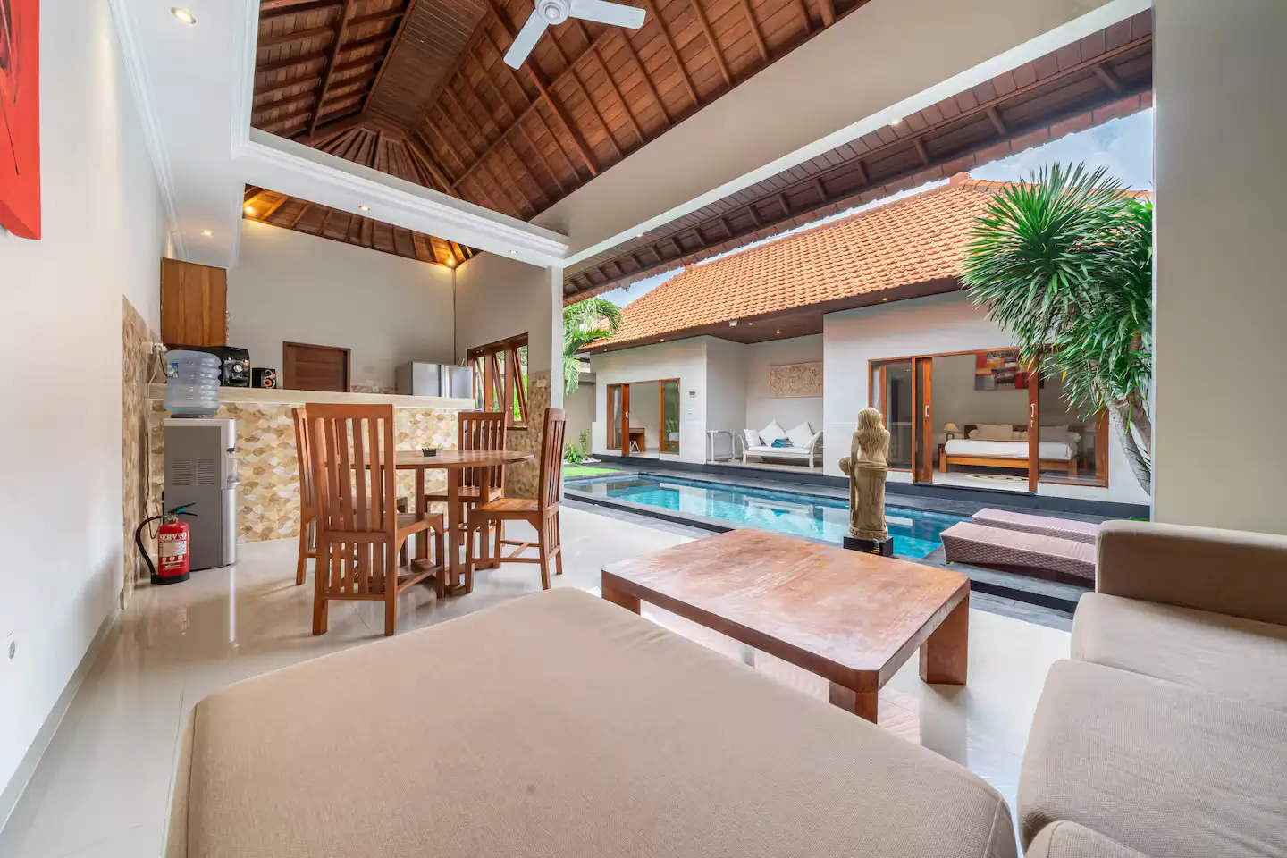 Stylish living area in your Kuta Utara Bali villa Chic open-plan living room with garden access in a Bali luxury villa